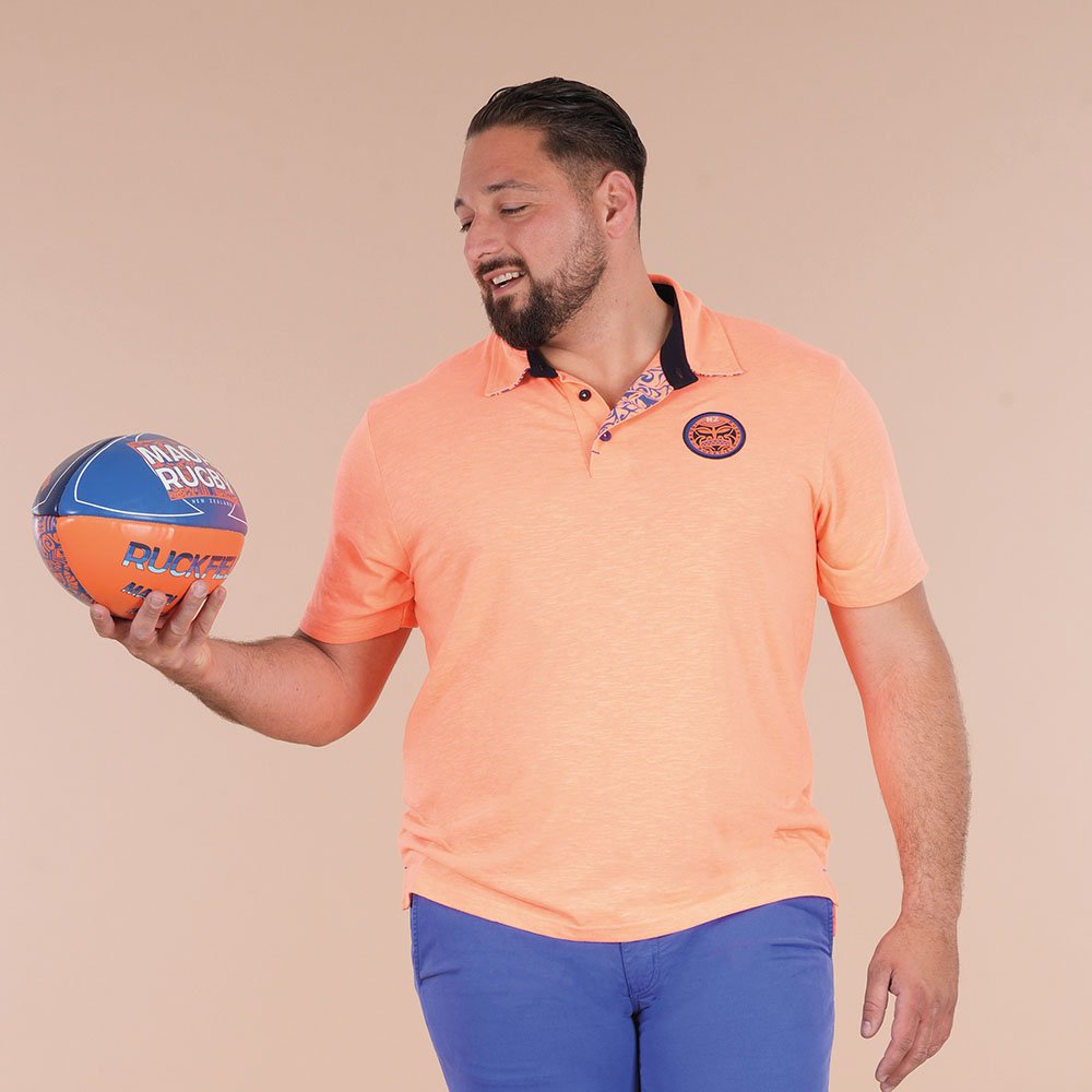 Featured image for “Polo à manches courtes orange vif Ruckfield Maori Rugby”