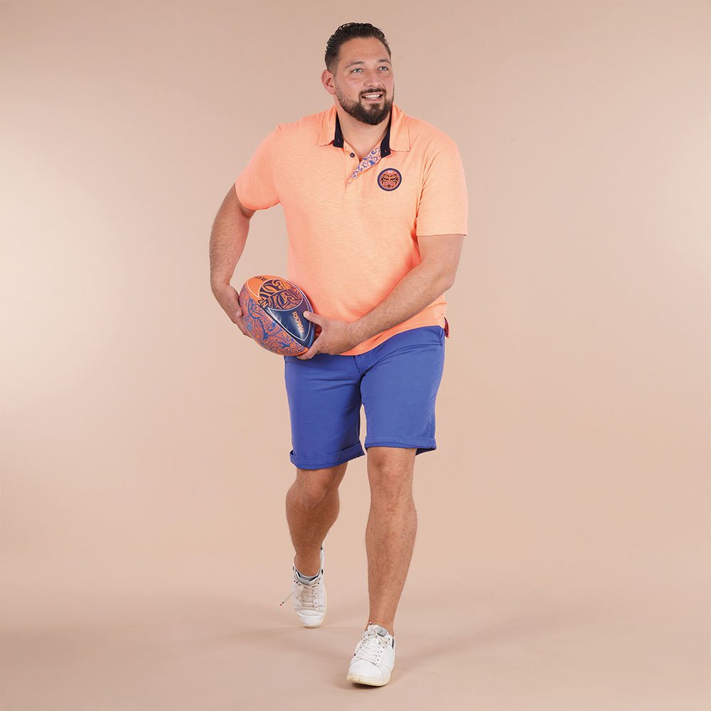 Featured image for “Polo à manches courtes orange vif Ruckfield Maori Rugby”