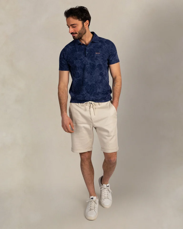 Featured image for “Polo en coton bleu foncé à imprimé Nza”